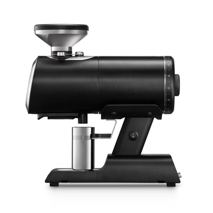 Black coffee grinder with metallic components on a white background
